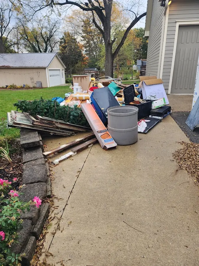 Dumpster being loaded with debris for Estate Cleanout Dumpster Rental in Lower Heidelberg